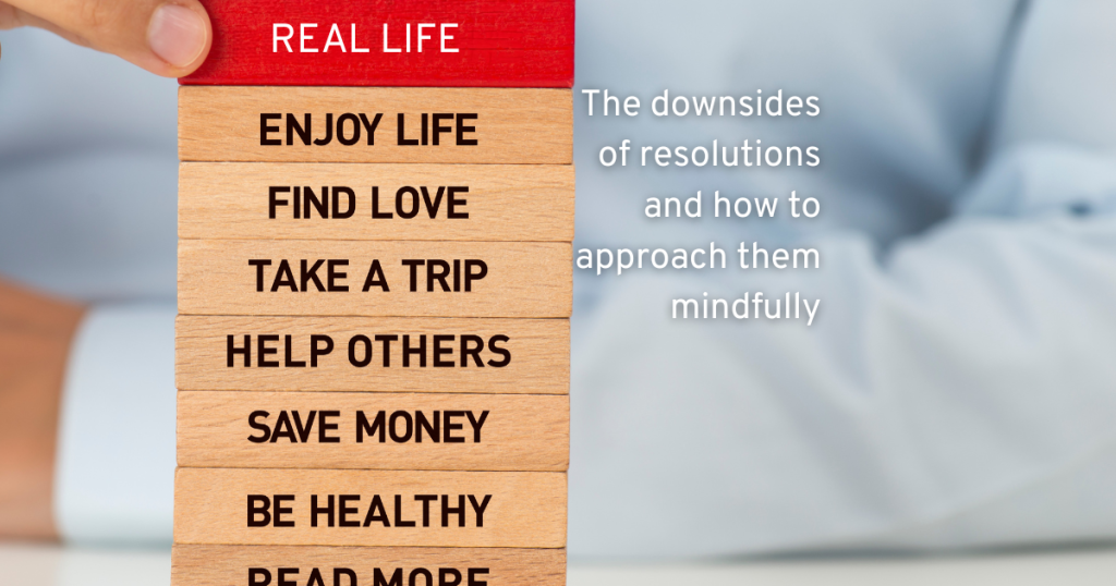 SETTING GOALS LIKE FIND LOVE, TAKE A TRIP, BE HEALTHY STACKING UP LIKE BLOCKS THEN A RED BLOCK IS PLACED ON TOP SAYING REAL LIFE. SHOWING US THE DOWNSIDES TO SETTING RESOLUTIONS AND WHY WE DONT STICK TO UNREALISTIC GOALS