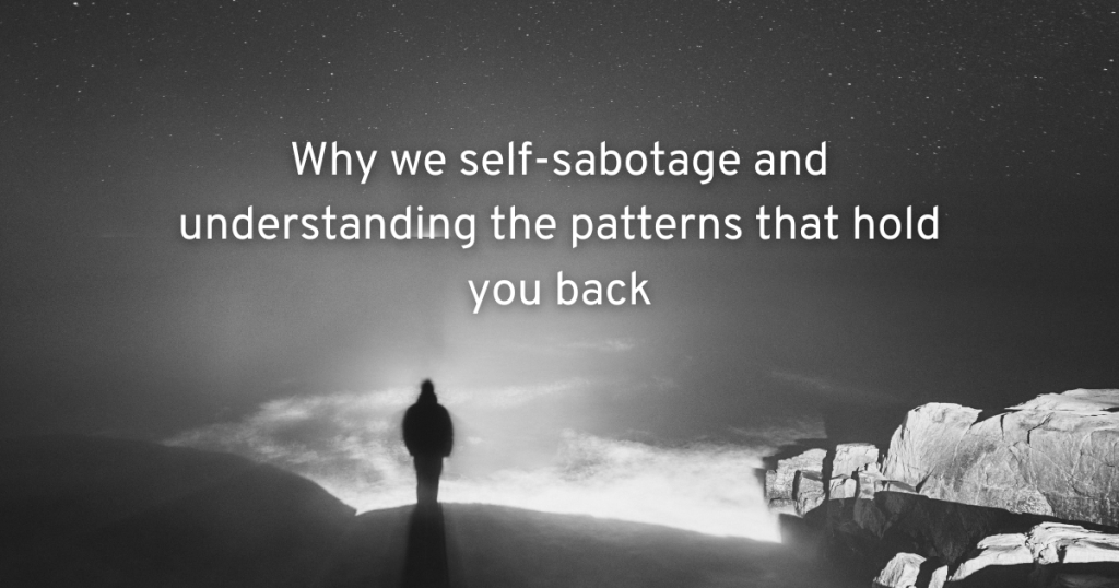 a black and white image on a silhouette of a man standing under a starry sky and looking out on a mountain top with clouds underneath and text why we self-sabotage and understanding patterns that hold you back
