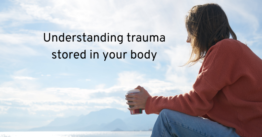 a woman sitting she is wearing jeans and a red sweater. text reads understanding trauma stored in your body