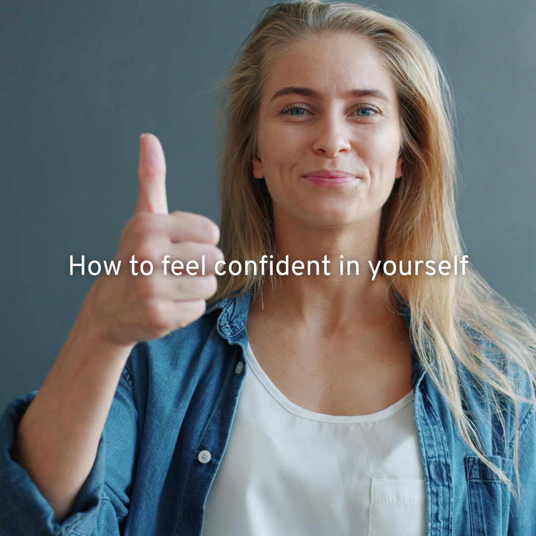 woman with white top and blue shirt with long blonde hair and holding a thumbs up with text how to boost confidence in yourself